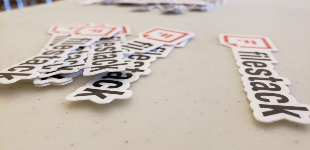 A sponsor table with Filestack stickers